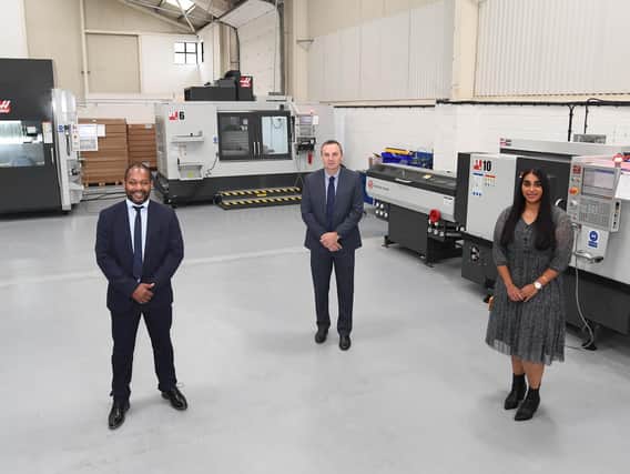 From left – Martin Nwangwa, Rob Coles, and Kierandeep Bal next to the new CMC
machines at Opus International. Photo supplied
