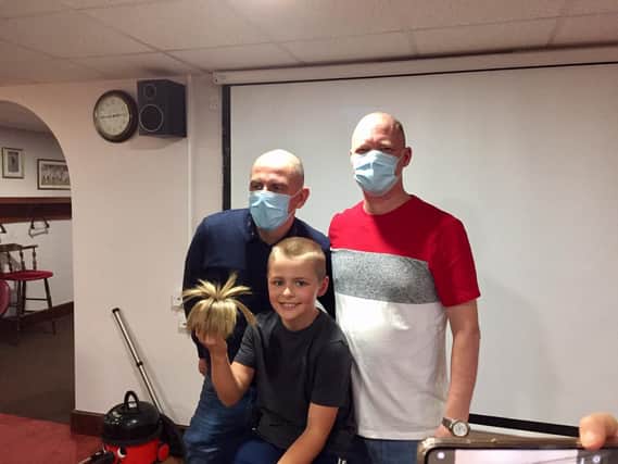From left: Father and son, Michael and Harry Horton, and family friend, Warren Nicholl, took part in the 'Brave the Shave' challenge on Sunday November 1 in Kineton to benefit Macmillan Cancer Support