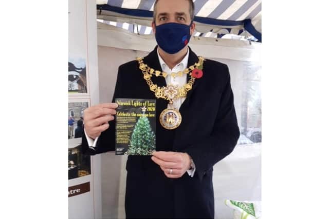 Cllr Terry Morris, Mayor of Warwick, at the visitor information stall at Warwick market. Photo supplied