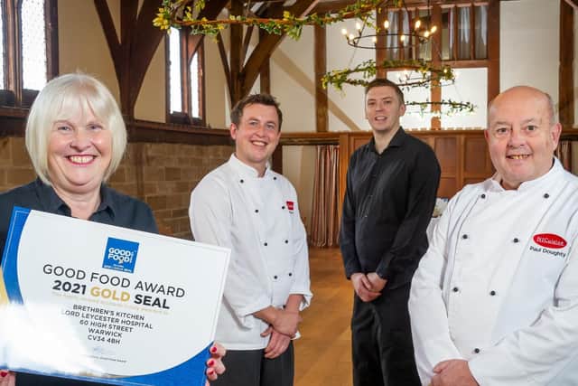 The team at the Brethren's Kitchen with their Good Food Award certificate