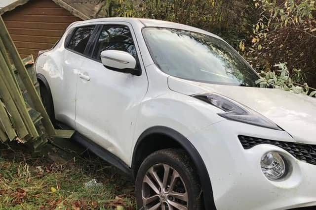 Two cars have been seized by police after a stolen motor smashed into a fence at a house in a village near Lutterworth.