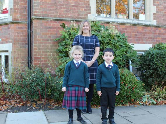 Assistant head Susan Glen-Roots with Reception children at Crackley Hall School in Kenilworth.