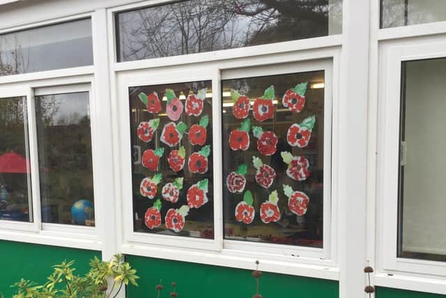 A classroom displaying poppies made by the children