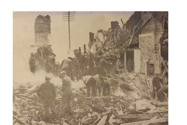 Rescuers toil through heaps of rubble to reach victims of a landmine explosion in Kenilworth.
