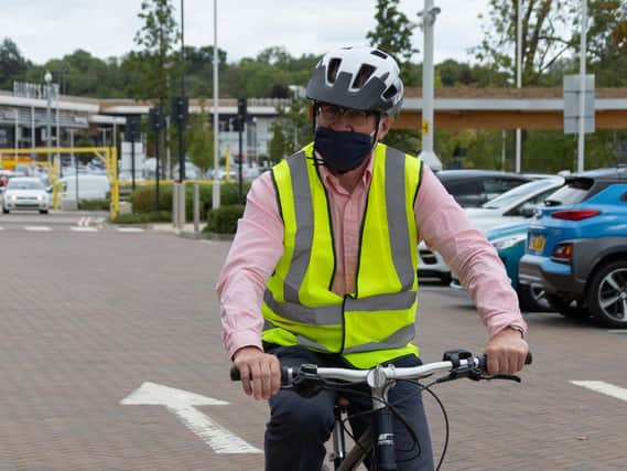 Mr Pawsey tries and e-bike at Halfords on Elliott's Field.