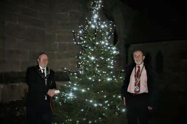 The photo at this year's Whitnash Tree of Light shows the Mayor of Whitnash Cllr Adrian Barton on the left and the president of the Rotary Club of Royal Leamington Spa Michael Heath on the right.