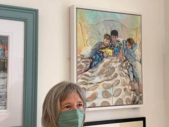 Susan Leonard with her painting "Are they Asleep?".
