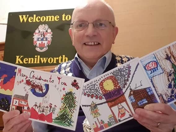 Kenilworth Mayor Cllr Richard Dickson with the winning Christmas card competition entries.