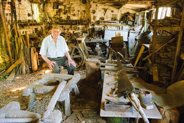 Bill Chedham, the last of the line, inside the smithy, prior to its restoration