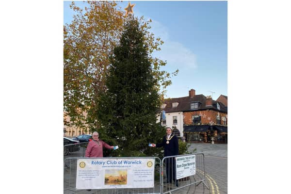Warwick Rotary President with Warwick Mayor, Cllr Terry Morris putting the first card on the Christmas tree in the Market Place. Photo supplied
