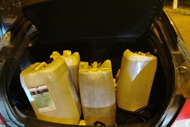 Around 100 litres of fuel were found in the back of the car the offenders had been travelling in. Photo: OPU Warwickshire, Facebook.