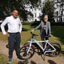 Leamington Mayor Cllr Susan Rasmussen receives her electric bike from Lash Saranna, chief executive officer of Electric Zoo.