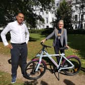 Leamington Mayor Cllr Susan Rasmussen receives her electric bike from Lash Saranna, chief executive officer of Electric Zoo.