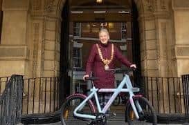 Leamington Mayor Cllr Susan Rasmussen with her electric bicycle outside Leamington Town Hall.