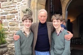 Evan and Brandon Whitt with veteran actor Charles Dance.