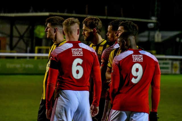 The Leamington and Brackley players line up for a set-piece during their 1-1 draw