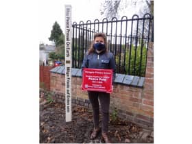 Rotarian Camille Sethi and the peace pole. Photo submitted