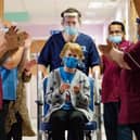 Maggie is clapped by NHS staff as she makes history. Photo: UHCW