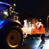 A group of farmers and villagers from Norton Lindsey brought some early festive cheer to local villages and Warwick town over the past few days with their Santa procession.  Photo by Gill Fletcher