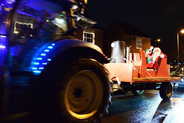 A group of farmers and villagers from Norton Lindsey brought some early festive cheer to local villages and Warwick town over the past few days with their Santa procession.  Photo by Gill Fletcher