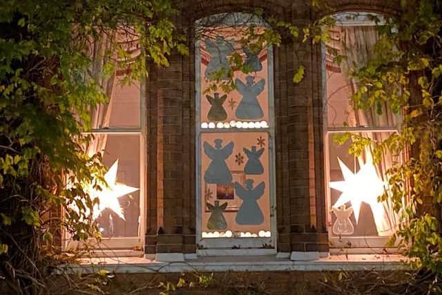 Neighbours in Arlington Avenue are revealing decorated windows, like the windows of an advent calendar, to bring a smile to faces at the end of a difficult year.