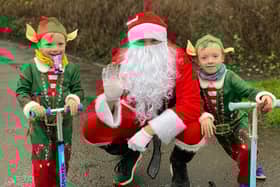 Logan Brittain, five, and his younger brother Jackson, three, donned the festive outfits and joined their dad Daniel, who was dressed as Santa,for the charity challenge braving the rain in the process.