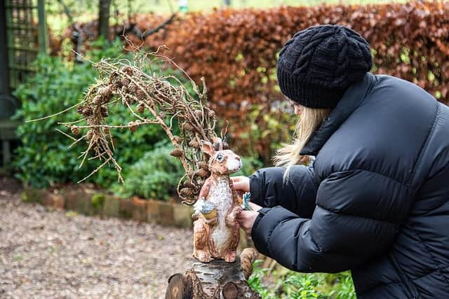 Ros Ingram with her ceramic sculpture at Charlecote Park. Photo by Jana Eastwood