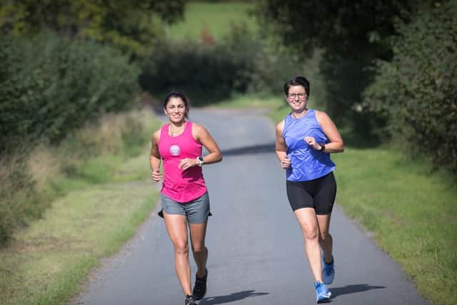 Lauren Gregory and Helen Wyatt during a different running challenge. Photo supplied