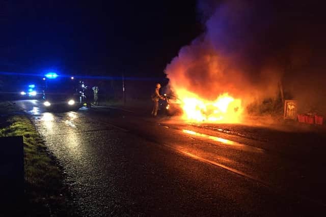 A driver's first trip out in his new car ended in disaster when he crashed his vehicle near Wellesbourne and watched it burst into flames. Photo from OPU Warwickshire.
