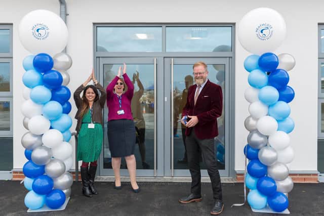 Celebrating the handover of the new classrooms are, left to right, deputy head Kim Abernethy, executive head Gill Humphriss and Philip Hamilton OBE, the CEO of Community Academies Trust, who performed the ribbon-cutting ceremony.