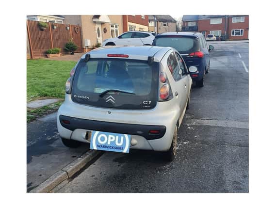 A driver in Whitnash who was not wearing a seat belt nearly reversed into a police car - because she was distracted while on her mobile phone. Photo by OPU Warwickshire.