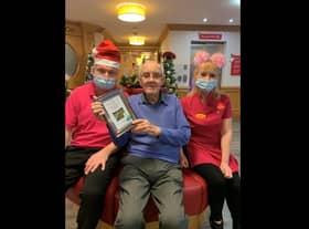 Paul and Noreen present Keith with the photograph.