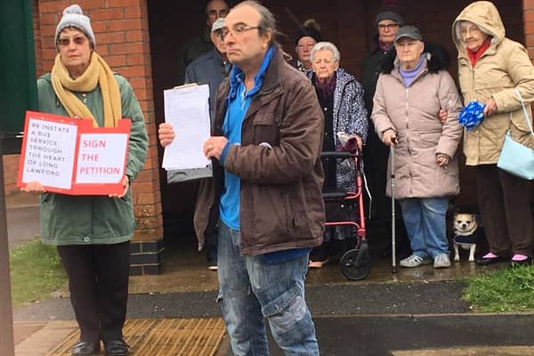 Bus campaigners in Long Lawford outside the former bus stop by Hurst Close in Round Avenue, Long Lawford, with copies of the 516-name petition in March 2019. Photo taken by Julie McLaren.