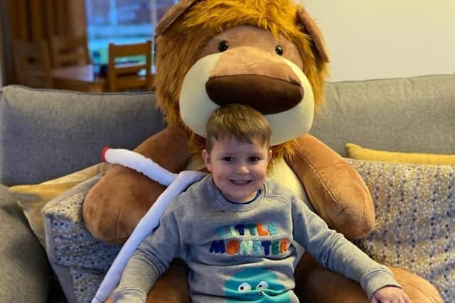 Four-year-old Aaron Carlyle with his supersized Olly The Brave. Photo supplied