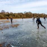 People skating on the frozen Welches Meadow today (Saturday February 13).