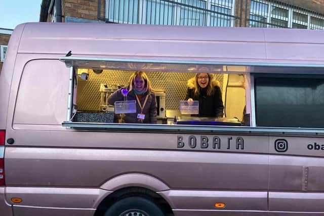 The new mobile catering van with Helping Hands CEO, Lianne Kirkman (right), and Support Worker Susan Verne (left), getting ready to serve. Photo supplied