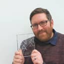 Warren Manger with his award. Photo supplied