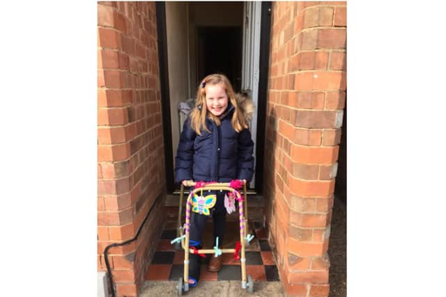 Lola Poyner has been completing daily laps around her garden as many times as possible, aided by either a frame or crutches. Photo supplied