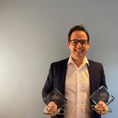 Kevin Riley with the two awards.