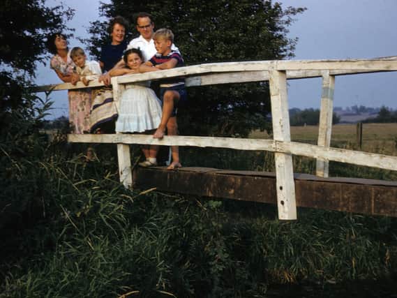 A family group enjoys life down at the ford sometime in the late 1950s.