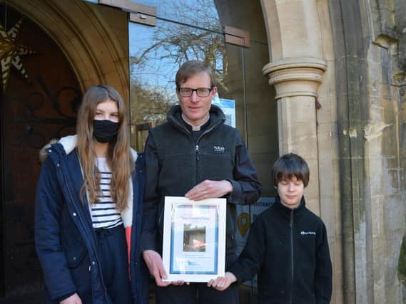 St Andrew's Rector Edmund Newey with two twinners.