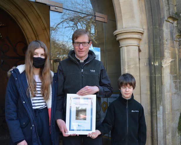 St Andrew's Rector Edmund Newey with two twinners.