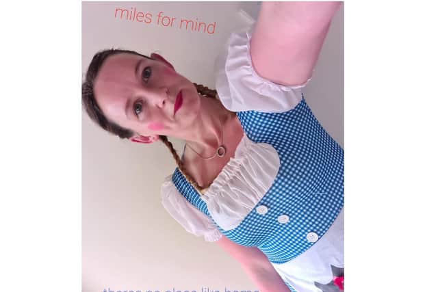 Natalie Faulkner wears her Dorothy from the Wizard of Oz costume as part of her Miles for Mind scheme last month - raising money and awareness for the charity Mind.