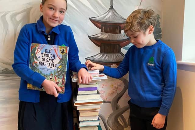 Emmy and Julian of Brookhurst Primary stack up supplies for the
Readathon. Photo supplied