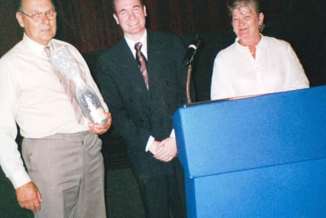 Peter Lee (left) with former Leamington cinema manager Gary Stevens and his assistant manager Sylvia Cleary.