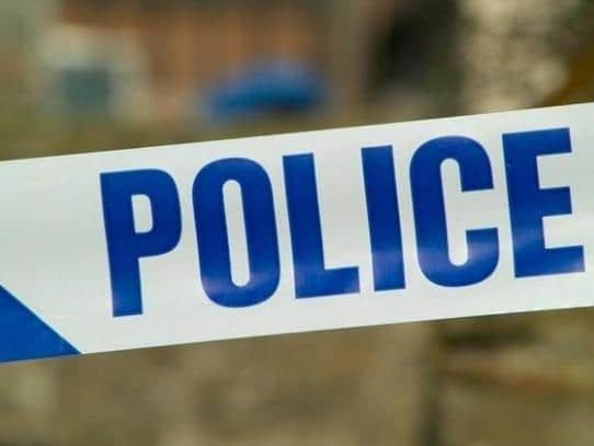 A man was threatened and robbed in broad daylight while he waited outside a shop in Leamington