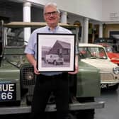 Jim Ellison, museum explainer with and archive print. Photo supplied