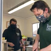 Jonathan Carter-Morris (L), with Andy Lock, general manager of the Virgins & Castle, preparing food for Band of Builders volunteers.