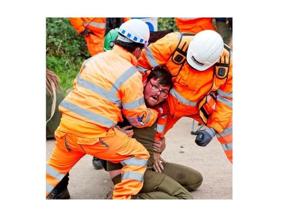 An anti-HS2 protester clashes with HS2 staff at the Rugby Road site near Cubbington in September 2020.