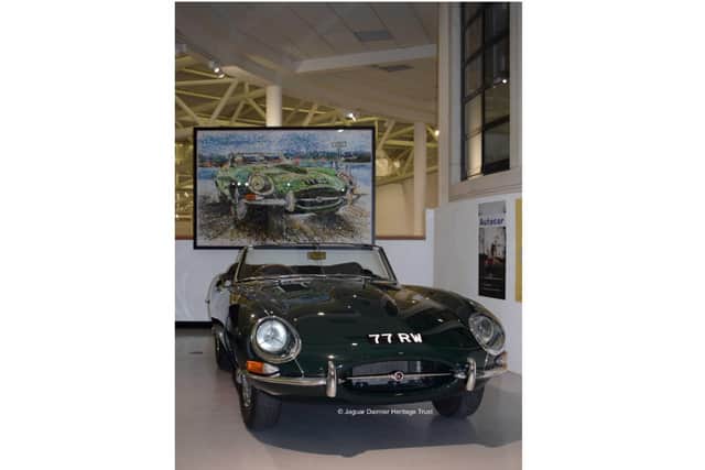 The 77 RW in front of the PopBangColour picture. Photo by Jaguar Daimler Heritage Trust